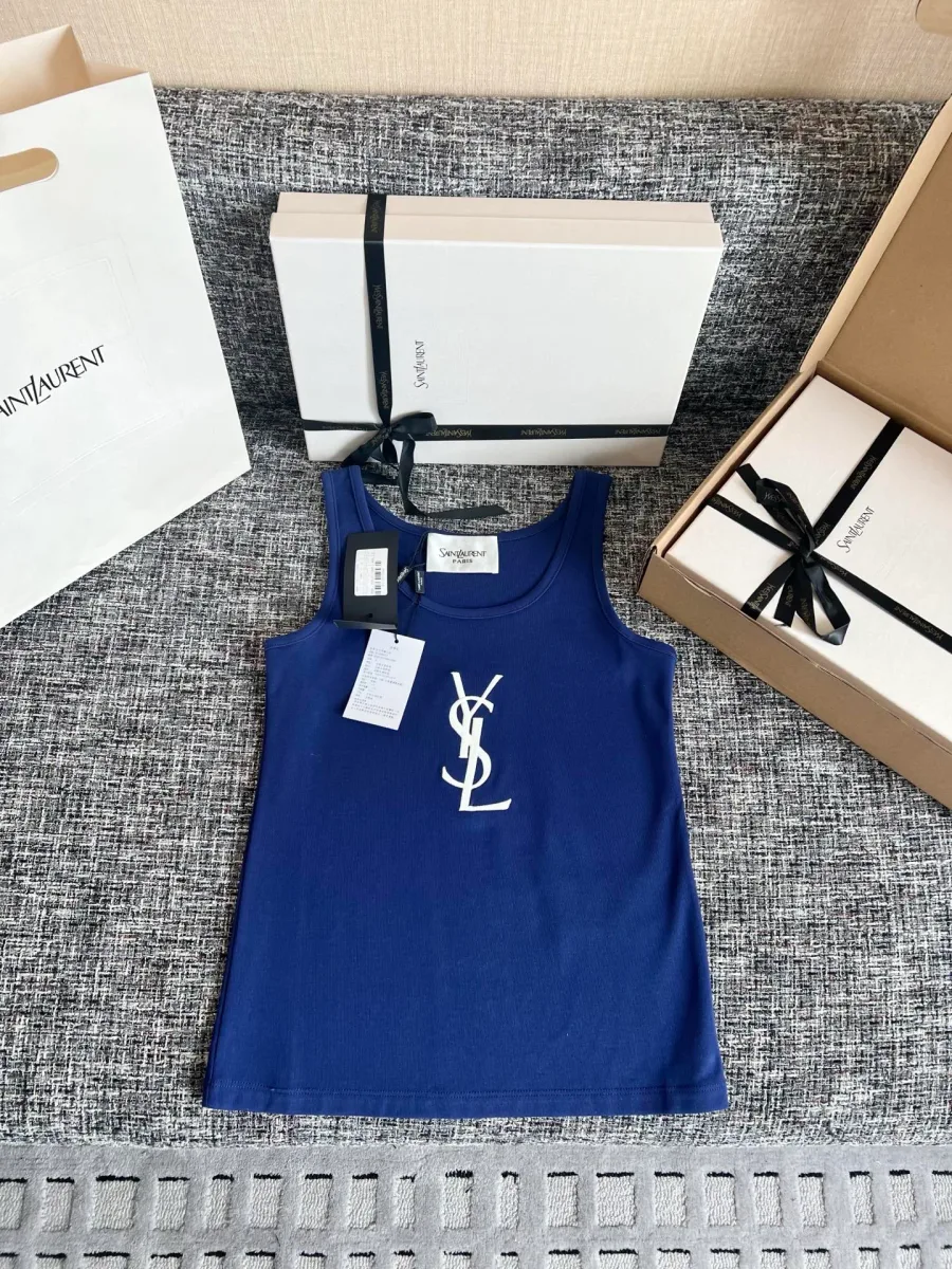 Синяя женская майка с белым логотипом Saint Laurent на фоне коробки