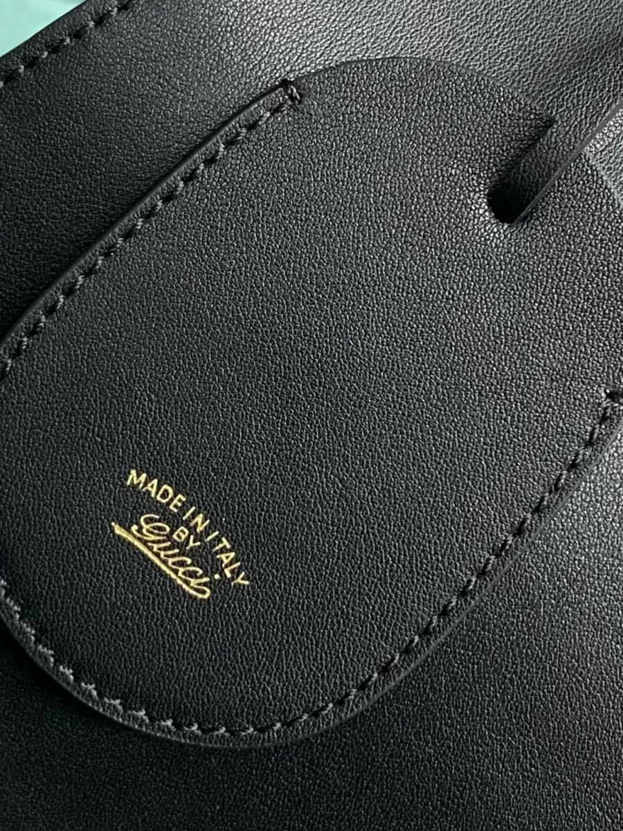 Кожаная бирка-брелок с золотистым тиснением Made in Italy by Gucci