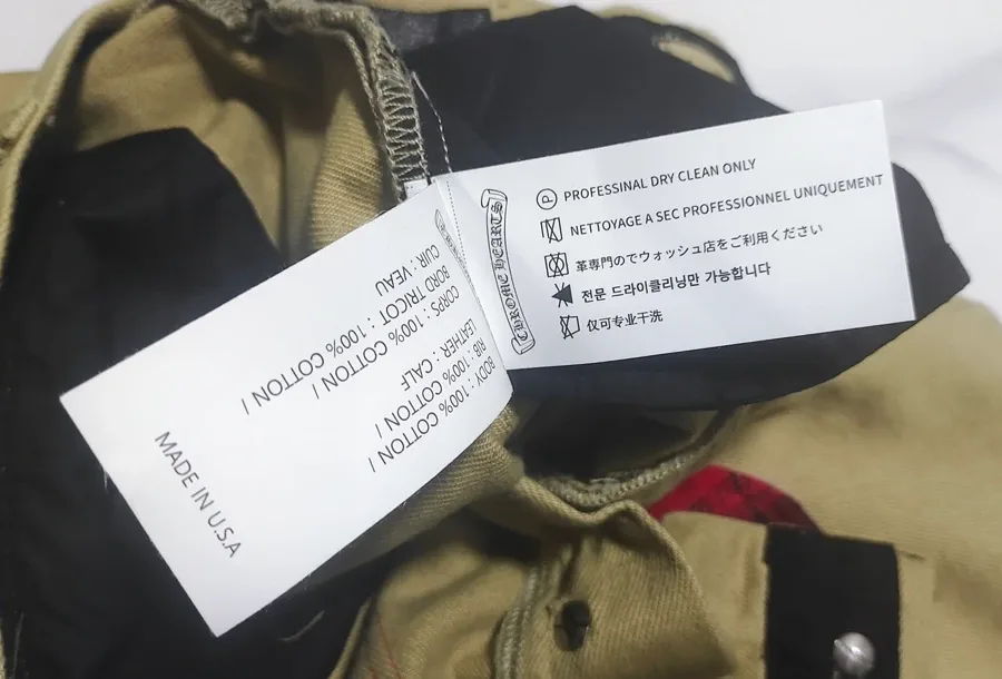 Внутренний ярлык штанов Chrome Hearts с указанием состава и страны производства