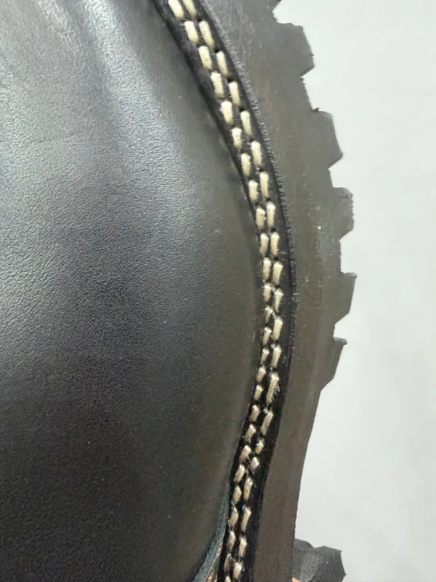 Крупный план швов и ранта сапог Chrome Hearts x Wesco