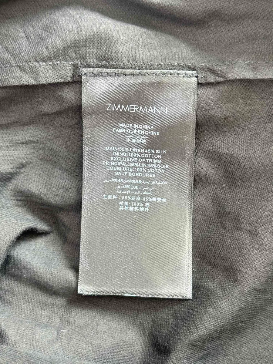 Вшитый ярлык с логотипом бренда Zimmermann и составом ткани