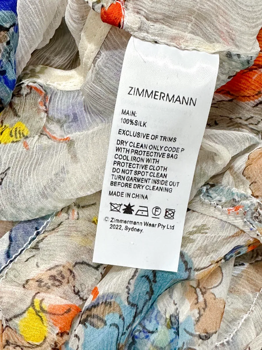 Фирменный ярлык с указанием бренда Zimmermann и состава ткани из 100% шёлка