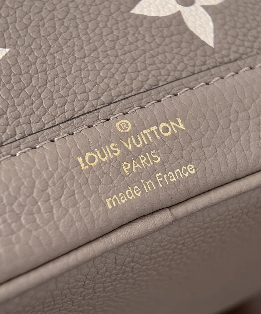 Тисненый золотистый логотип Louis Vuitton Paris на кожаной детали сумки