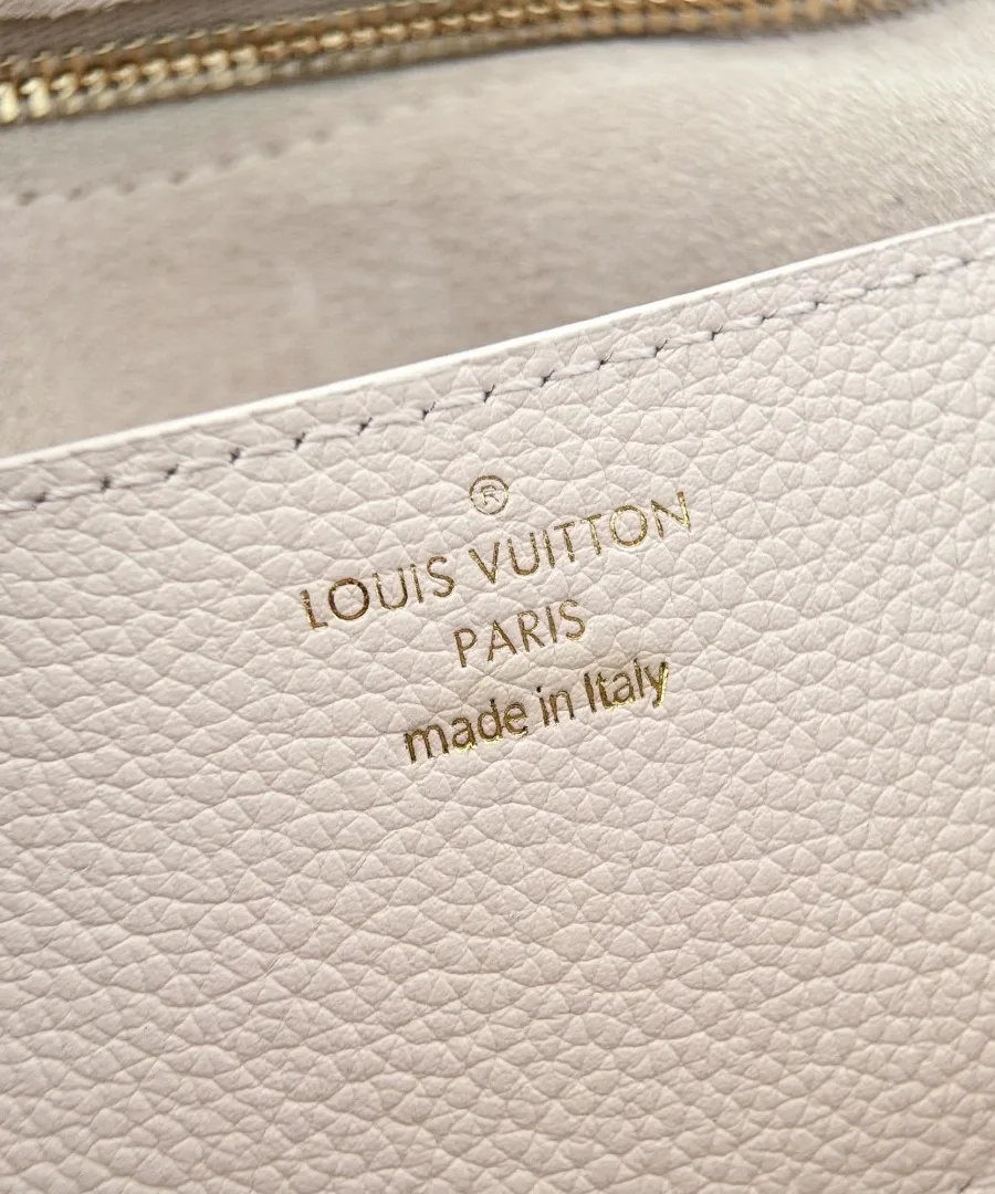 Тиснение Louis Vuitton Paris золотистым шрифтом на внутренней стороне