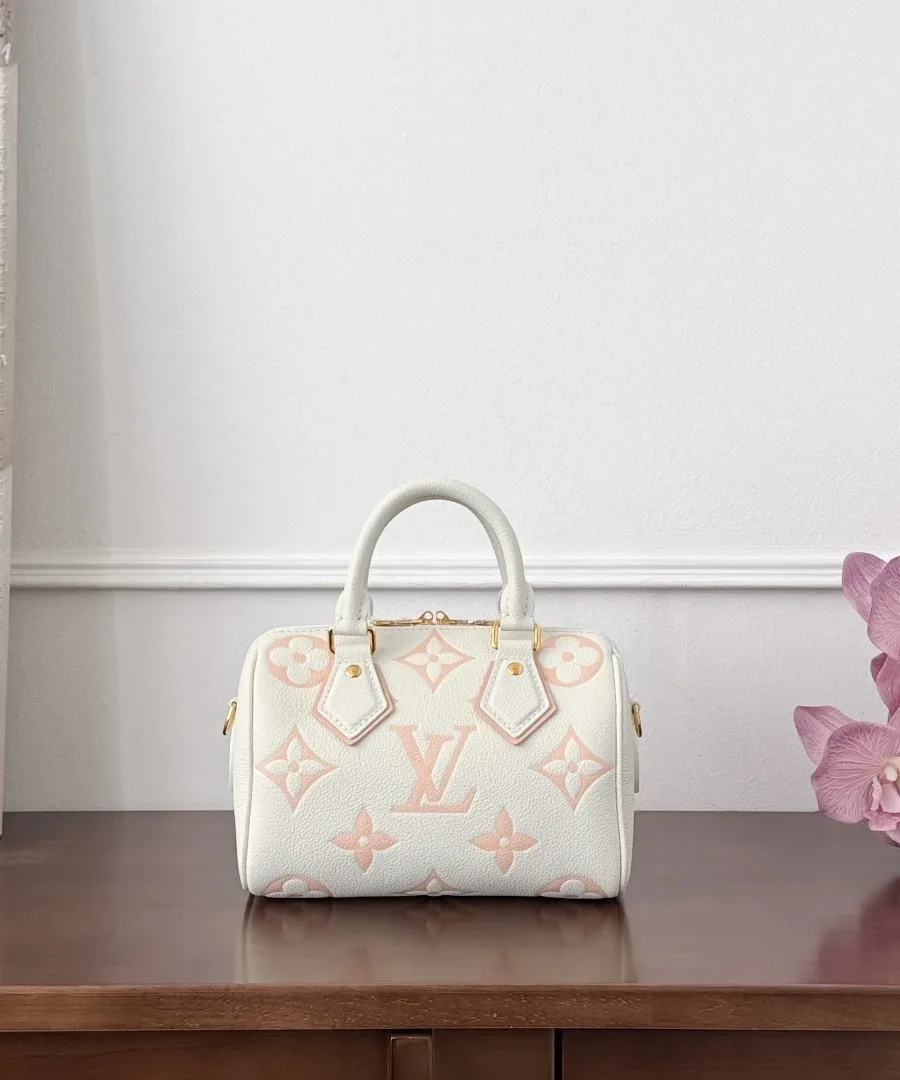 Белая сумка Speedy 20 с розовым узором Monogram, вид спереди