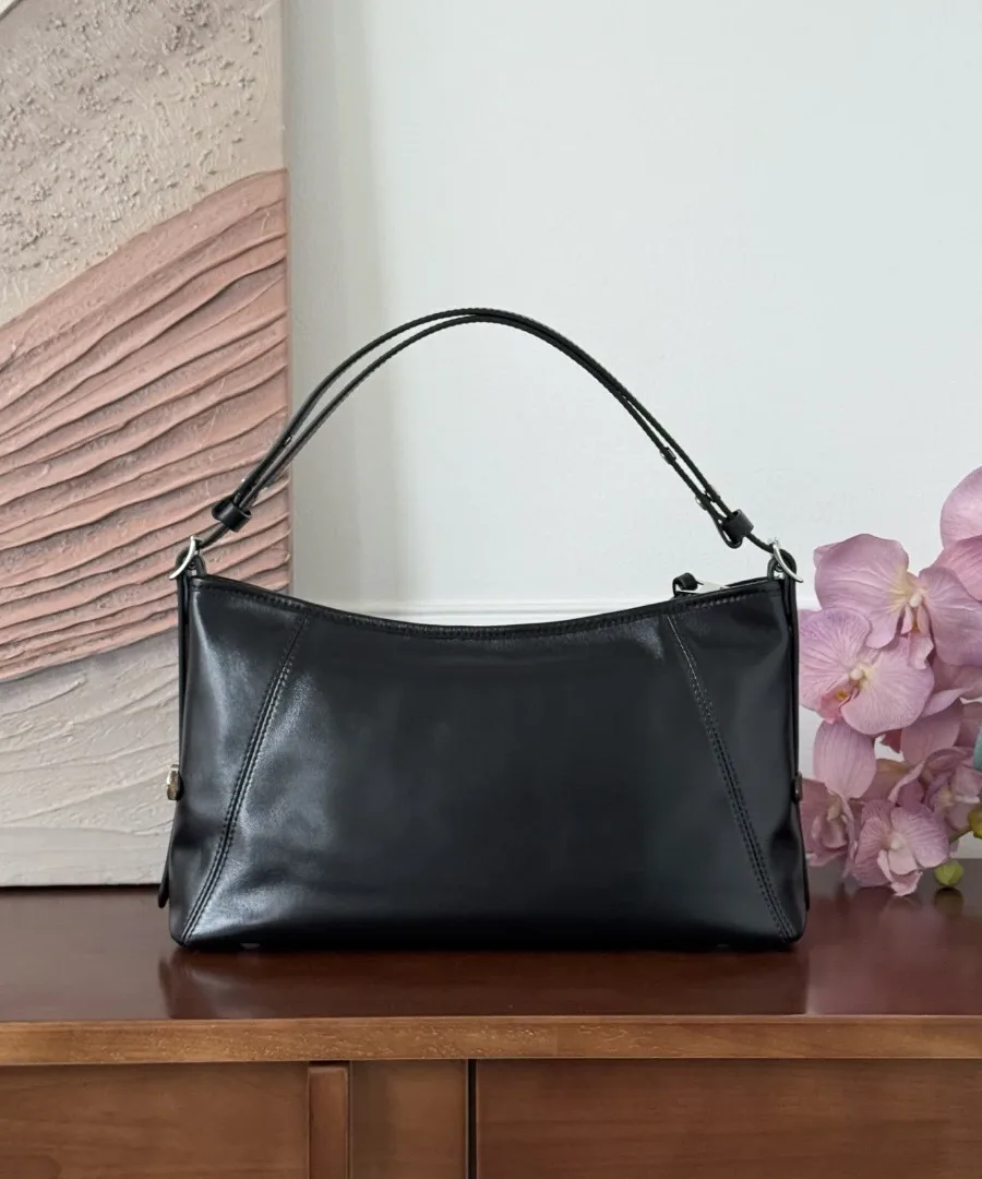 Черная кожаная сумка Louis Vuitton Carryall, вид сзади