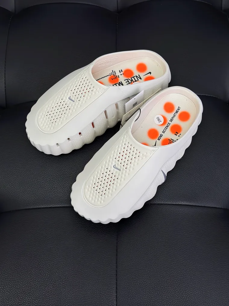 Nike Бежевые сабо Mind 001 с оранжевыми узлами на подошве